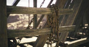 CGI Rusty chains on weathered beams in an abandoned, rocky area video