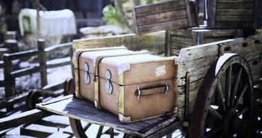 CGI Old wooden cart with vintage suitcases in a rustic setting video