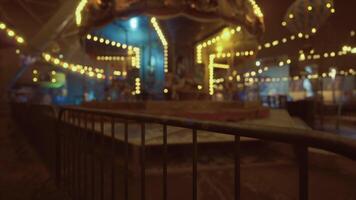 CGI Carnival carousel illuminated by lights during evening festivities video