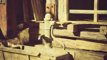 CGI Vintage water pump stands in rustic wooden environment during daylight hours video