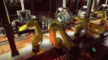 CGI Industrial robots work together on an automated assembly line in a factory video