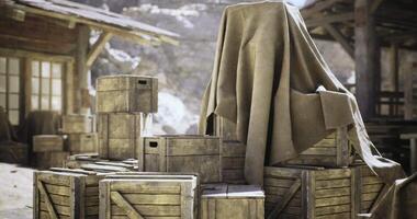 CGI Wooden crates stack under a cloth in a rustic outdoor setting during daytime video