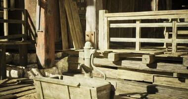 CGI Water pump and rustic wooden structures in abandoned homestead setting video