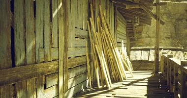 CGI Wooden structure and bamboo sticks organized beside a rustic pathway video