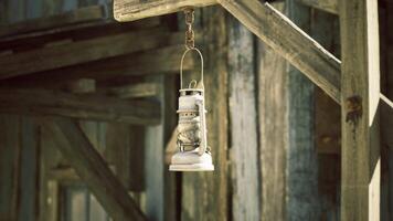 CGI Hanging lantern on a rustic wooden structure in a historical setting video