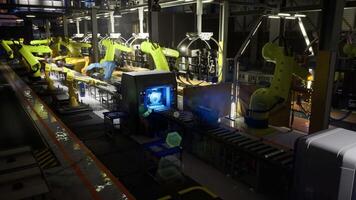 CGI Industrial robotics assembly line operating in a modern facility at night video