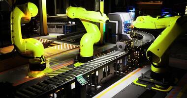 CGI Advanced robotic arms working on an assembly line in a modern factory setting video