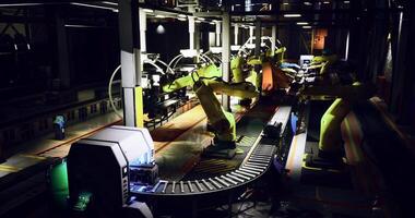 CGI Industrial robots working on a production line during nighttime hours video