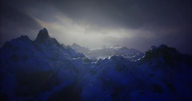 CGI Dramatic mountain landscape under a moody sky at twilight video