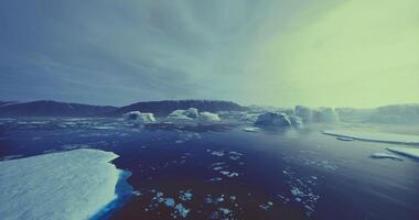 CGI Majestic icebergs floating in tranquil Arctic waters during twilight hours video