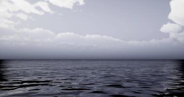 CGI Calm ocean water reflecting cloudy sky at twilight video
