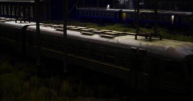 CGI Old train in an abandoned station with overgrown grass during twilight video