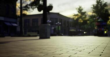 CGI Colorful sunset view of an urban street with shops and walking path video