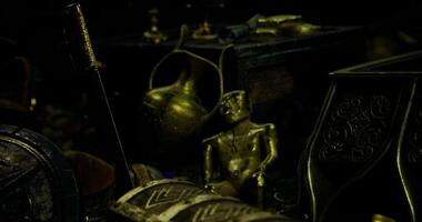 CGI Ancient artifacts showcase intricate design and craftsmanship in dark setting video