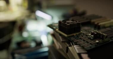 CGI Close up view of a circuit board with components in a dimly lit workshop video