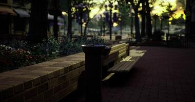 CGI Quiet urban park benches with nature and sunset glow in the background video