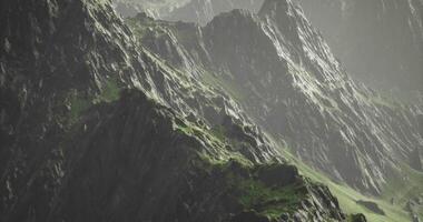 CGI Mountains with rugged terrain and lush greenery during misty daylight video
