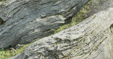 CGI Natural rocky formation with textured surface in a serene outdoor setting video