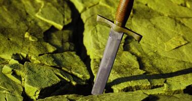 CGI Sword embedded in cracked green stone with a textured surface video