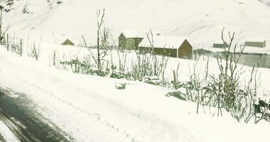 CGI Snow covered landscape with rustic huts in a quiet winter setting video