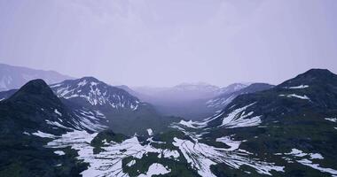 CGI Majestic mountain landscape with snow and green valleys during twilight video