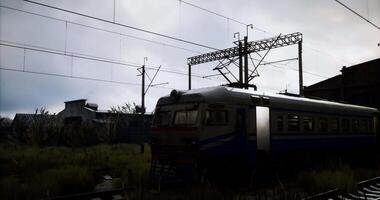CGI Train parked in an industrial area under a cloudy sky during early evening video