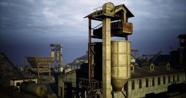 CGI Old industrial buildings under cloudy skies in a deserted area video
