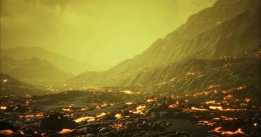 CGI Volcanic landscape with flowing lava under a yellow sky at dusk video