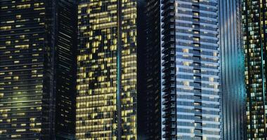 CGI City skyline illuminated at night with glowing windows and modern architecture video