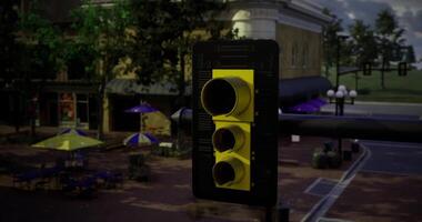 CGI Unique yellow traffic signal illuminated at dusk in a bustling town square video