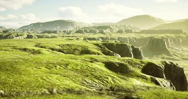 CGI Lush green hills under a bright sky at sunset in a tranquil landscape video