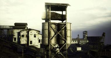 CGI Industrial structures rise against a moody sky in a desolate location video