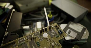 CGI Old circuit board and various electronic components scattered on a worktable video