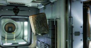 CGI Gasoline canister floats in zero gravity aboard the international space station video