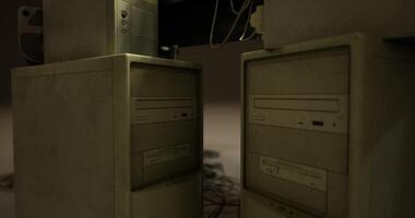 CGI Computers in a dimly lit room showing wear and age from extended use video