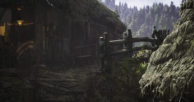 CGI Rustic cabin surrounded by lush greenery and wooden fence in remote location video