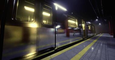 CGI Subway train waiting at the station during night hours with bright lights video