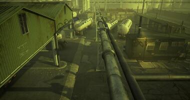 CGI Industrial pipeline network at dusk in a warehouse area with storage tanks video