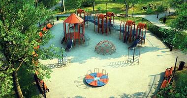 CGI Colorful playground equipment in a well maintained park on a sunny day video
