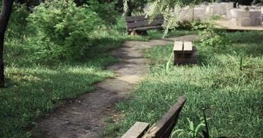 CGI Pathway through a serene garden leading to an event area with tables video