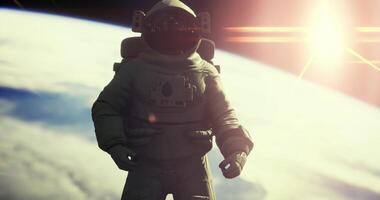 CGI Astronaut floating in space above Earth with sunlight illuminating the scene video