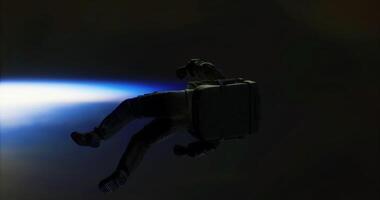 CGI Astronaut floating in space with a luminous blue light backdrop video