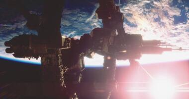 CGI Space station orbiting Earth with sunlight illuminating the horizon video