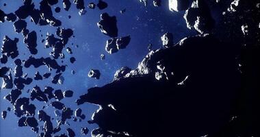 CGI Asteroids drift through the vastness of space in a dynamic celestial display video