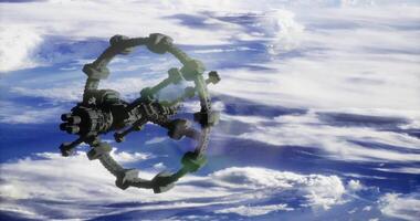 CGI Space station orbits Earth with clouds and atmosphere in the background video