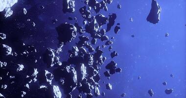 CGI Numerous asteroids floating in the vastness of space against a dark background video