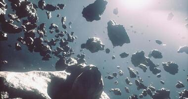 CGI Dense asteroid belt with various rock formations floating in space video