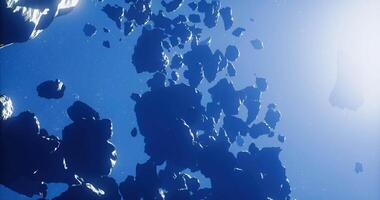 CGI Exploring the vast expanse of asteroids floating in deep space video