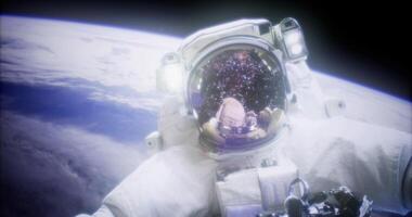 CGI Astronaut floating in space with Earth in the background and stars visible video