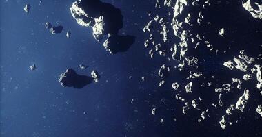 CGI Exploring a dense field of asteroids floating in deep space during twilight video